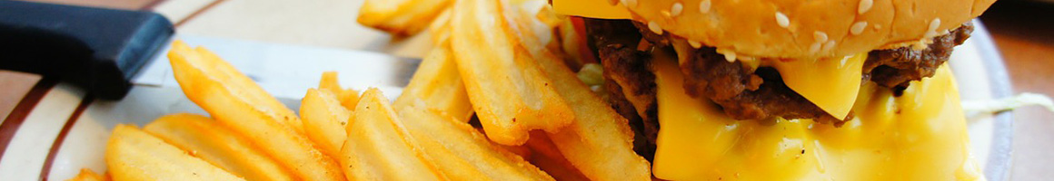 Eating Burger at Highlander's Grill restaurant in Hickory Hills, IL.